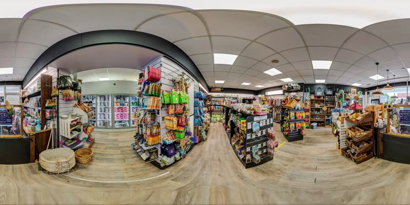 Inside the shop, stocked shelves and aisles of pet food and supplies